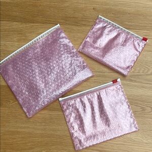 Set of three Glossier Pink Bubble Wrap Pouches